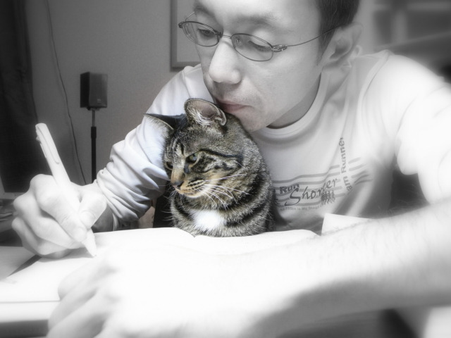 Old man studies with a cat